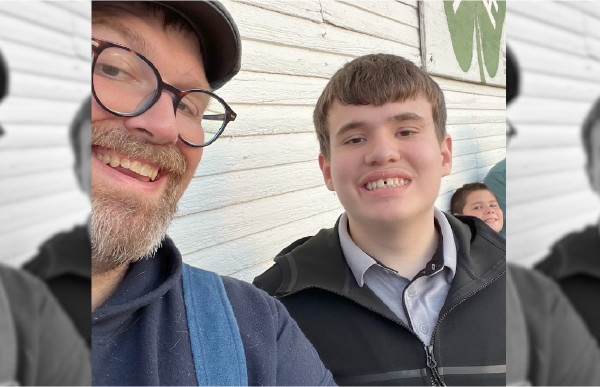 A selfies of two smilling men
